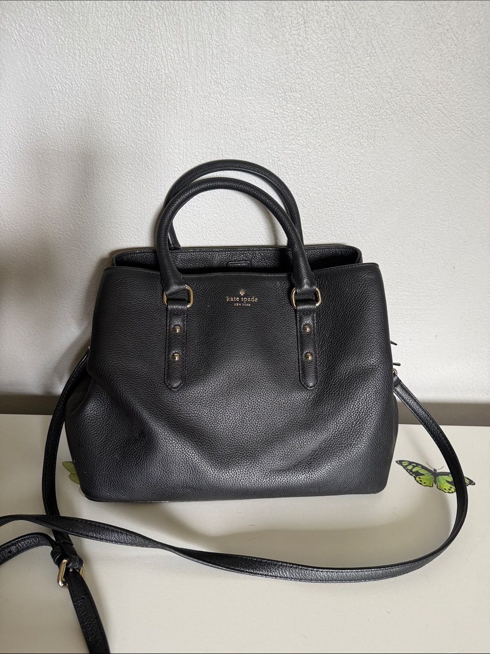 kate spade black leather satchel with gold-tone logo